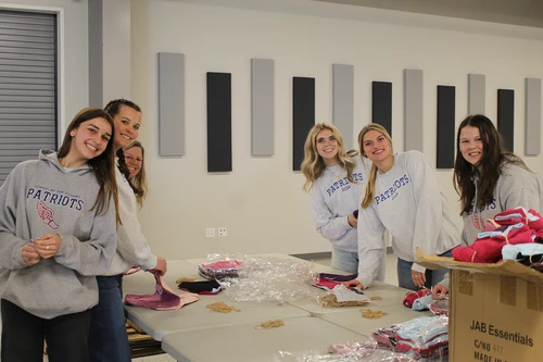 S of O students package washcloths for Convoy of Hope to send out in disaster relief.